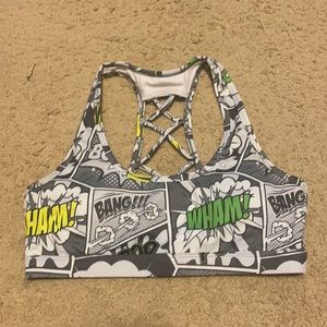 Comic book print Feed Me Fight Me sports bra